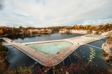 Fotobehang  Swimming, paddling pools, sunbathing platforms on Zakrzowek lake famous landmark in Krakow Poland. © alexanderuhrin