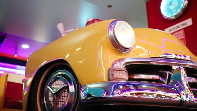 Close up of two retro cars headlights in restaurant