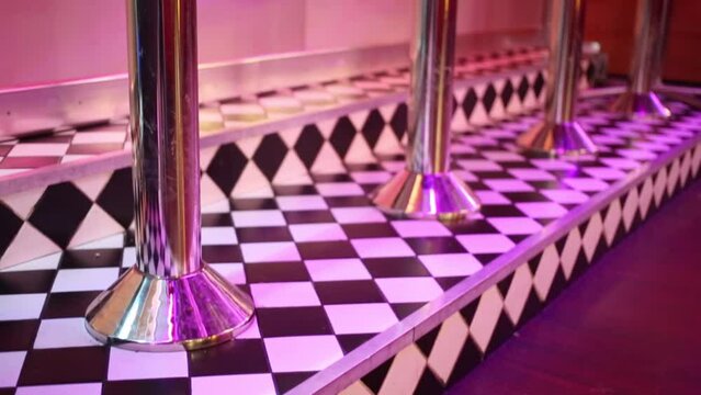Close up view of red seats near bar counter in restaurant