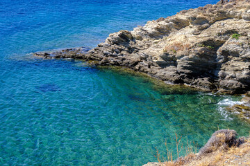 Coastline with turquoise water on Tinos Island