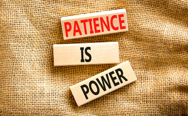 Patience is power symbol. Concept words Patience is power on beautiful wooden blocks. Beautiful canvas table canvas background. Business and patience is power concept. Copy space.