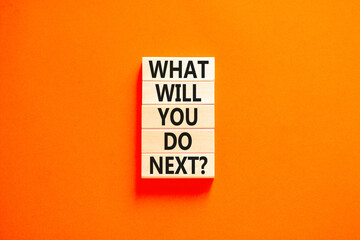 What will you do next symbol. Concept words What will you do next on wooden blocks. Beautiful orange table orange background. Business, what will you do next concept. Copy space.