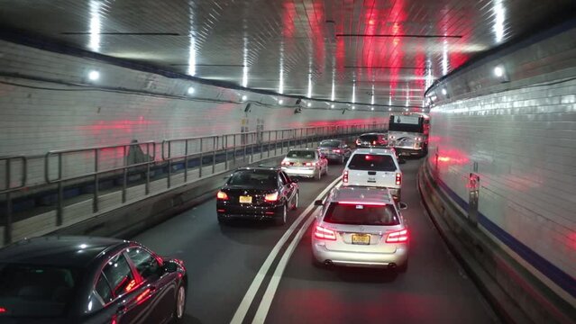 Cars move along the Lincoln Tunnel in New York. 