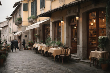 View of a street with italian cafes and restaurants, houses, cobblestone