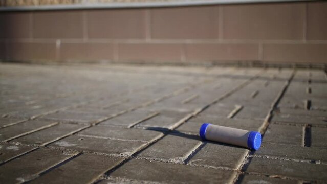 Gorodki game. Bat knocks out five pins put in a row.