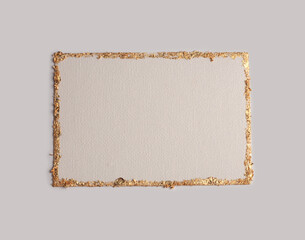 Beige and Gold glitter empty canvas frame card on gray paper background. Abstract copy space...