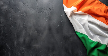 Irish flag draped against a dark textured background - obrazy, fototapety, plakaty
