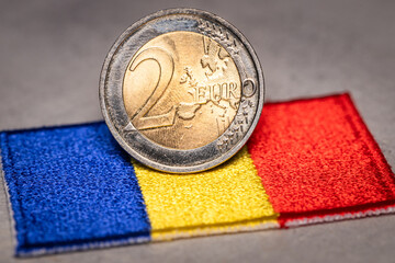Romania euro, Romania joining the euro zone, Romanian flag and 2 euro coin, Financial concept,...