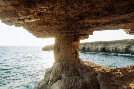 Sunset Radiance at Cape Greco's Sea Caves