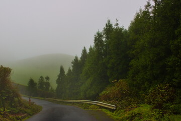 Fog covers the road and the mountains