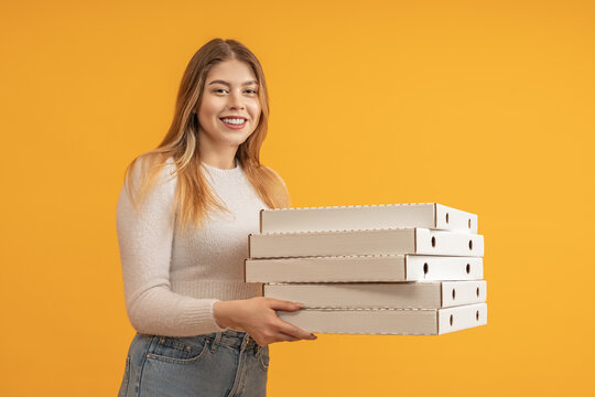 Woman Holding A Stack Of Pizza Boxes