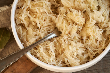 Fermented cabbage or sauerkraut in a bowl with a fork