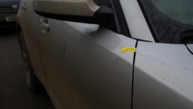 Hood and doors of car close up with sticker Special Parking GKY AMPP