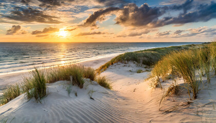 Wallpaper sunset at the dune beach at the sea. Beautiful nature background