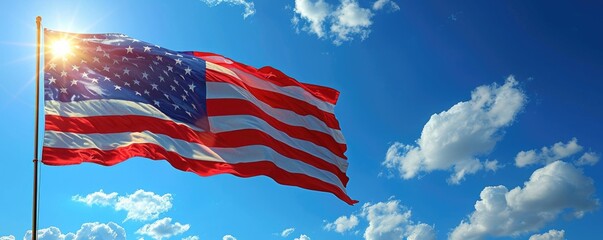 U.S. flag waving against blue sky