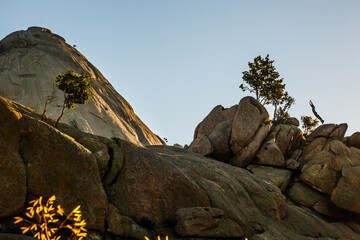 Yelmo granitic stone in the pedriza illuminated by light pollution