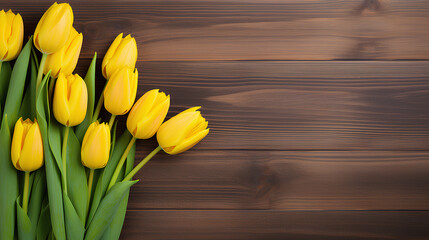  Yellow tulips on wooden background with copy space.