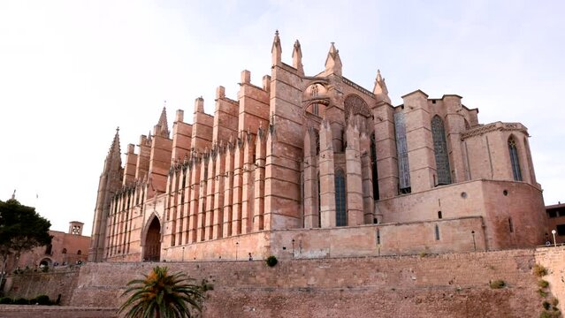 a late afternoon wide angle shot of the cathedral of santa maria of palma at mallorca in spain