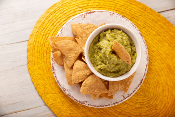 Guacamole. Avocado dip sauce, one of its many ways of consuming it is spread on tortilla chips also called Nachos. Mexican easy homemade sauce recipe very popular.
