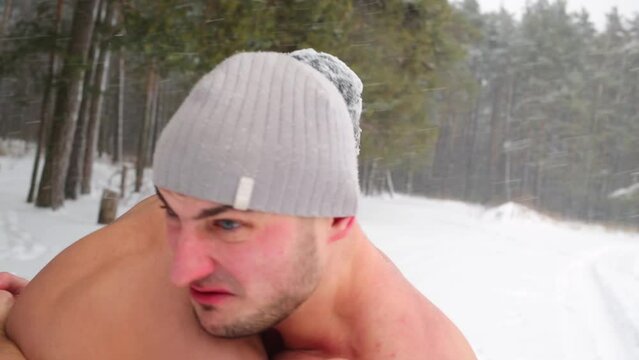 Closeup heads, shoulders and arms of two guys wrestling at sportsground