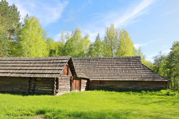 Fototapeta na wymiar Traditional wooden Ukrainian houses from Transcarpathia in Pirogovo, Ukraine