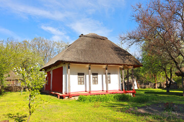 Fototapeta na wymiar Traditional Ukrainian house from Polissya Region in Pirogovo, Ukraine