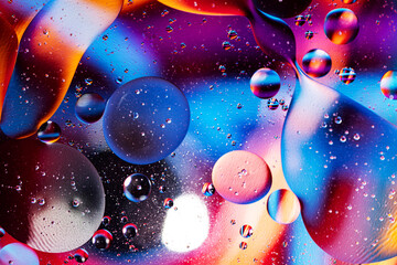 colorful light and water drops on glass, breathtaking view created by light and water. Macro...
