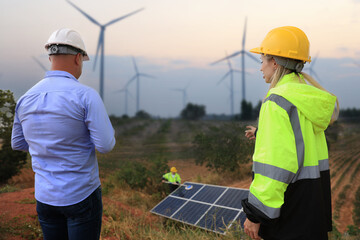 Businessman or owner check job progress of solar panel installation, sustainable and renewable...