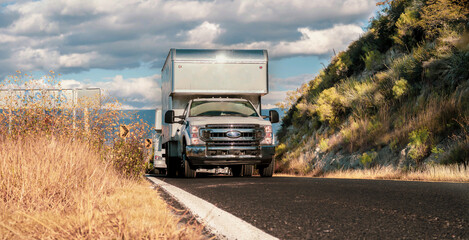 Commercial vehicle transporting commercial cargo on a semitrailer on a highway