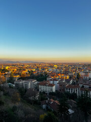 Fototapeta na wymiar Sunset over the city of Bergamo. View from Citta Alta Bergamo, Italy