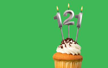 Birthday card with candle number 121 - Cupcake on green background