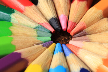 Fototapeta premium Macro photo of colored pencils together in a circle. Concept of desk tools.
