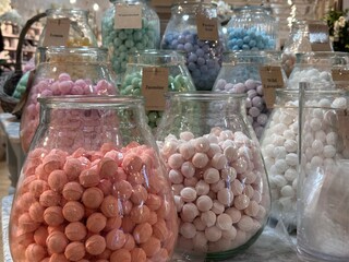 Cropped shot of  glass jars filled with colorful bath bombs