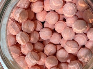 Top view close up of many pink bubble patch in a jar