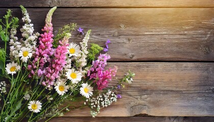 Summer flowers on wooden background with copy space