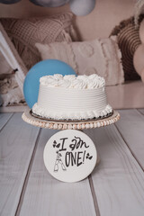 One year old cake with a sign