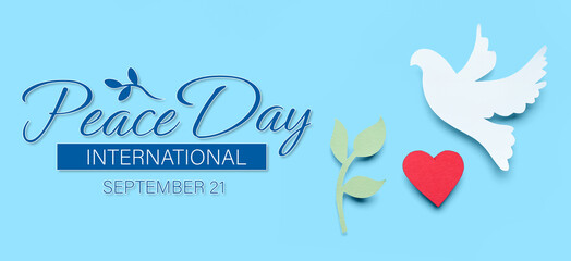 Paper dove, olive branch and heart on light blue background. Banner for International Day of Peace