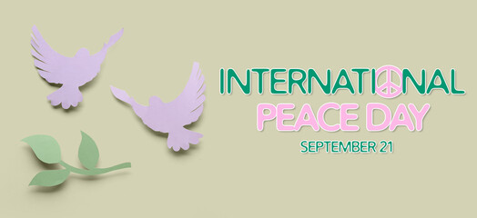 Paper doves and olive branch on color background. Banner for International Day of Peace