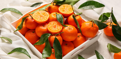 Tray with sweet tangerines on white background