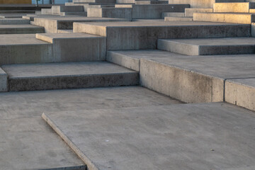 Fototapeta na wymiar Perspective view of concrete stairs in the park. Abstract background