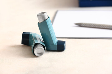 Asthma inhaler on table in doctor office