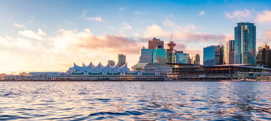 Canada Place and city building skyline at cloudy sunrise. Downtown Vancouver