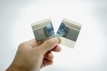 Hand holding credit card cut in to half. Showing no more credit, or tired of using the credit from...
