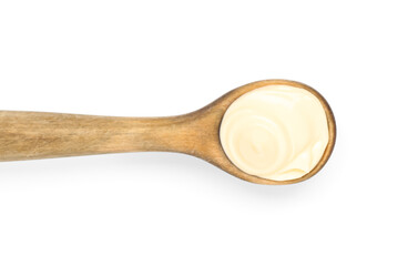 Spoon of fresh mayonnaise on white background