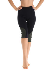 Fototapeta premium Young woman in black cycling shorts on white background