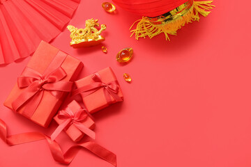 Gift boxes with Chinese symbols on red background. New Year celebration