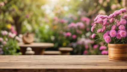 Tuinposter empty wooden table for product display with aster garden background © adynue