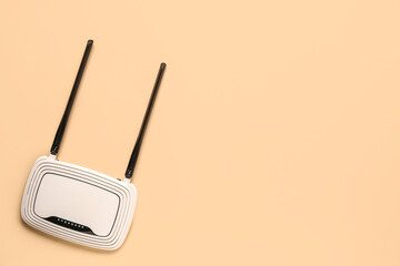 Modern wi-fi router on beige background