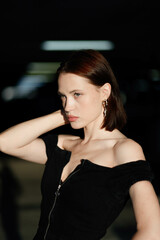 sensual beautiful brunette woman in black dress enjoying the sun, beautiful model