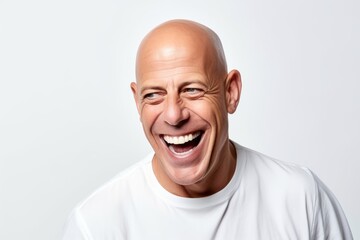 Portrait of a laughing mature man looking at the camera on a white background